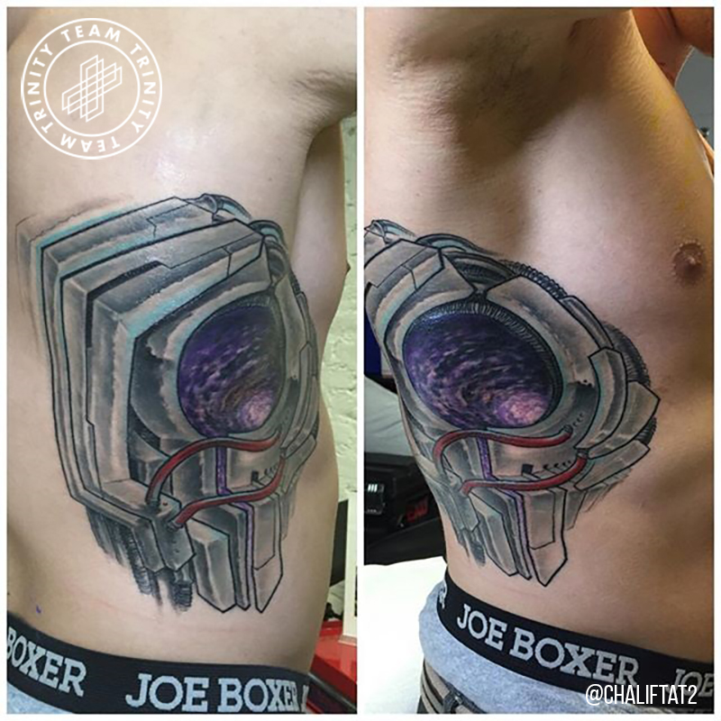 mechanical looking tattoo on rib cage